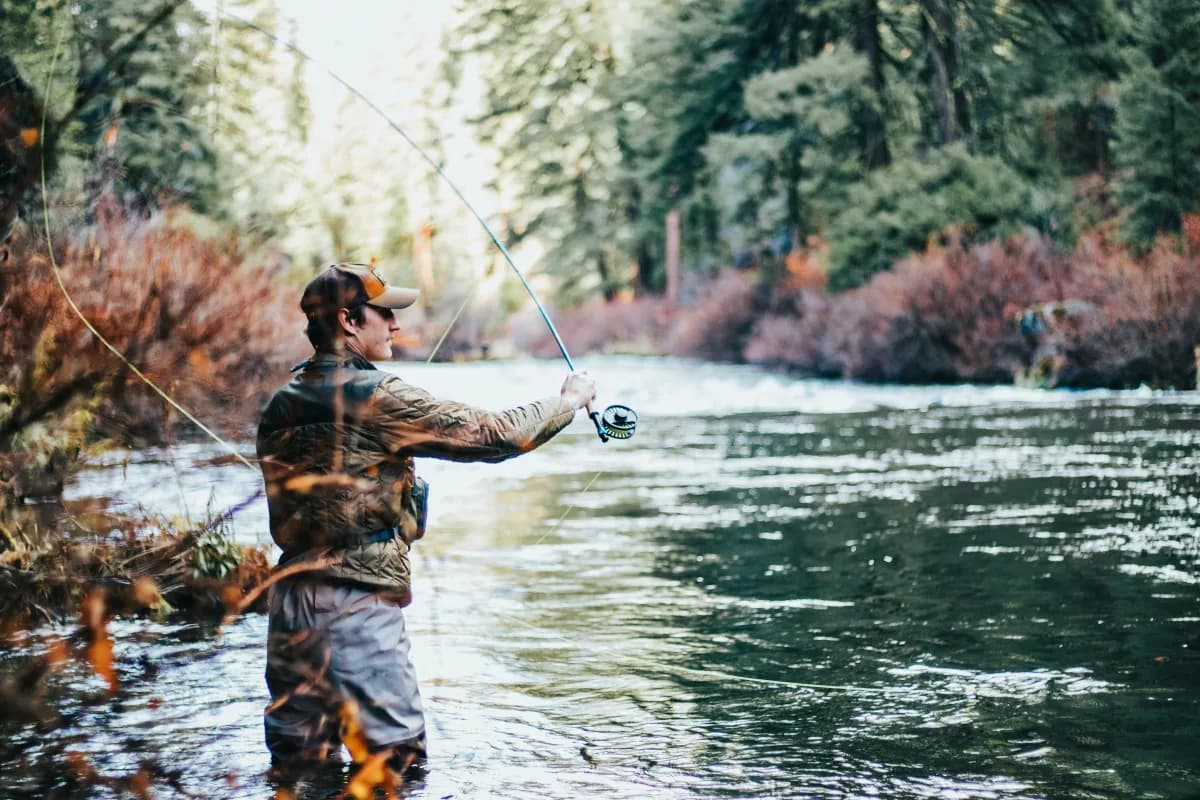 An angler casting on a river