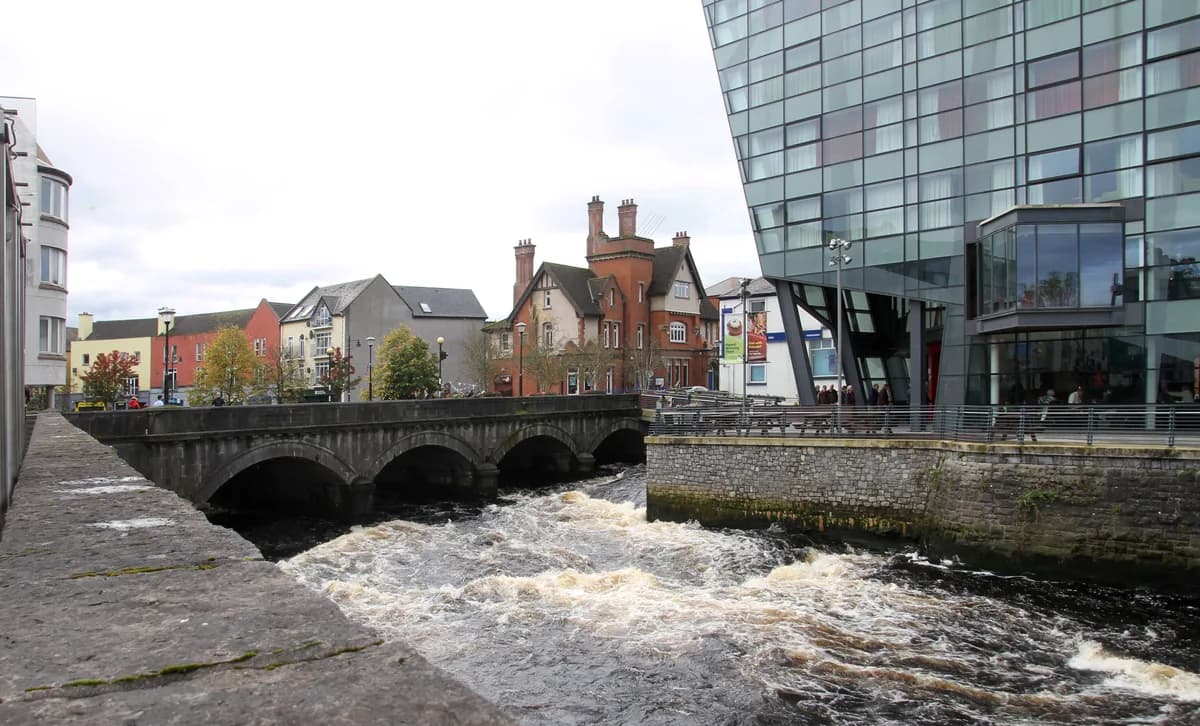 The Garavogue River in Sligo town centre, Ireland, with the Glasshouse Hotel on the bank.