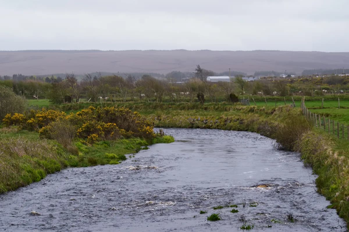 The Glenamoy River flowing through open bogland in north County Mayo, Ireland.
