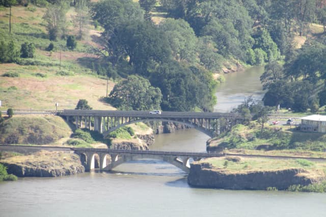 Wide view of the Klickitat River gorge with highway and railroad bridges crossing near its mouth on the Columbia River, Washington