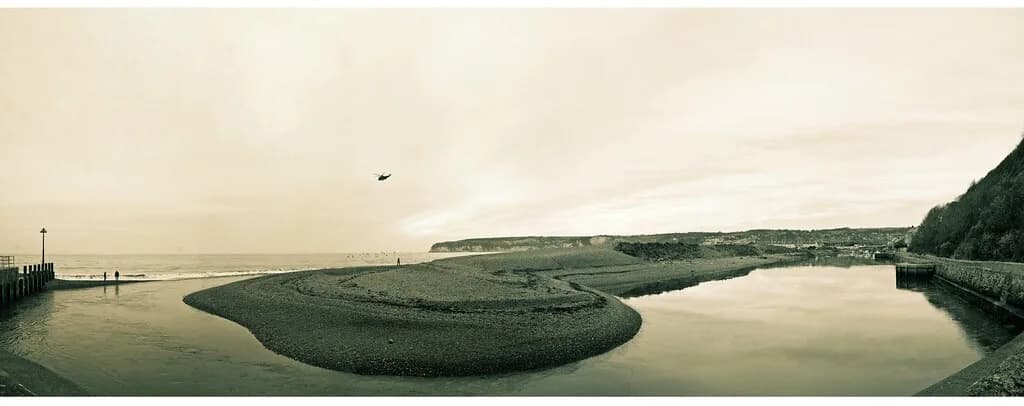 River Axe — The mouth of the Axe with birds, walkers and helicopter
