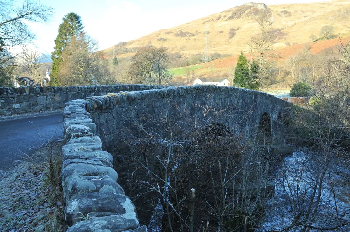 The River Orchy flowing beneath Dalmally Bridge in Argyll, Scotland, with hills in the background.