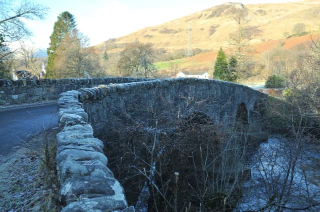 The River Orchy flowing beneath Dalmally Bridge in Argyll, Scotland, with hills in the background.