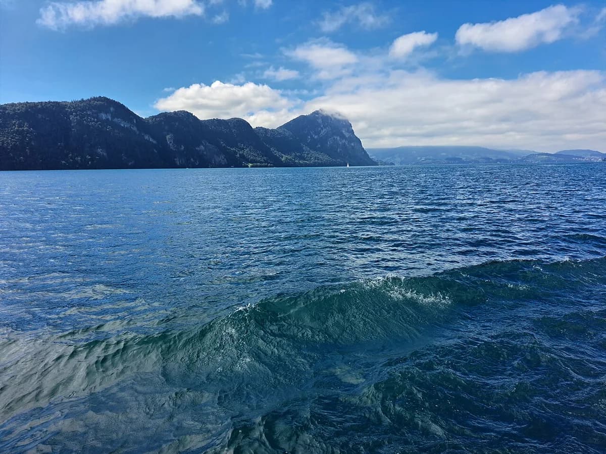 Open water on Lake Lucerne with the surrounding Alpine peaks