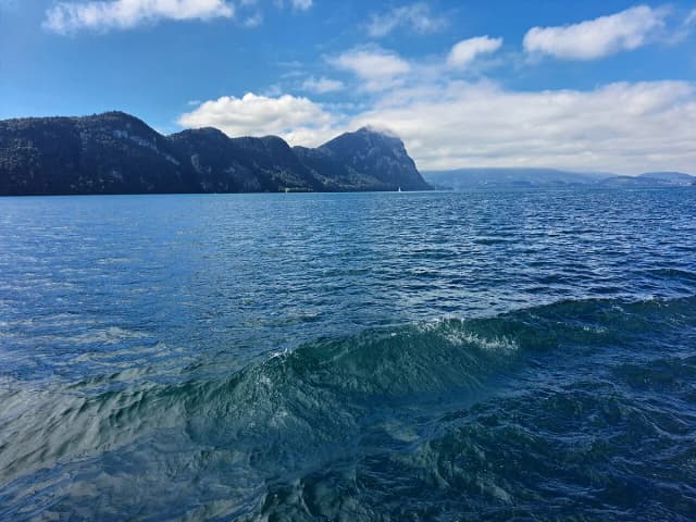 Open water on Lake Lucerne with the surrounding Alpine peaks