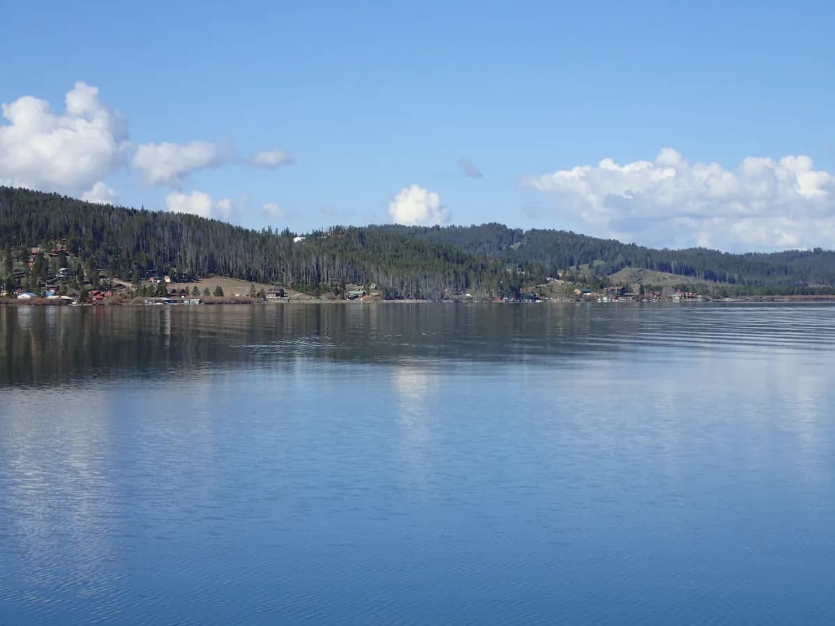 Wide calm view of Georgetown Lake with forested hills in the Pintler region of Montana