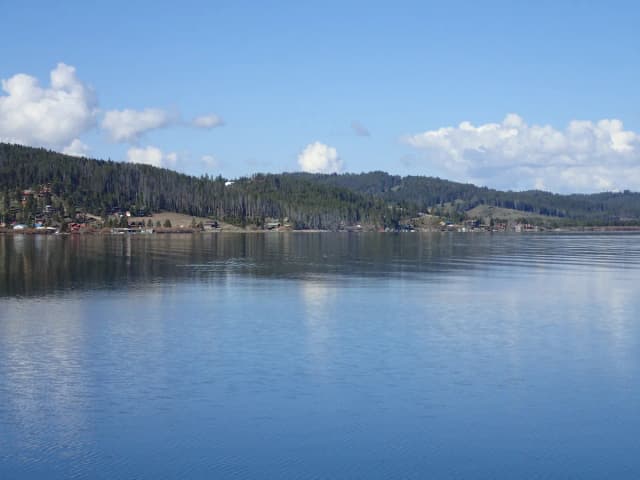 Wide calm view of Georgetown Lake with forested hills in the Pintler region of Montana
