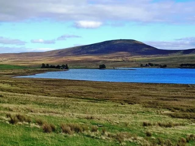 Wide view across Harperrig Reservoir towards East Cairn Hill in the Pentland Hills
