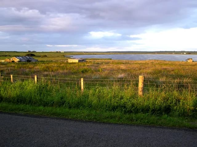 St John's Loch in Caithness, Scotland, at evening with anglers fishing from the shore.
