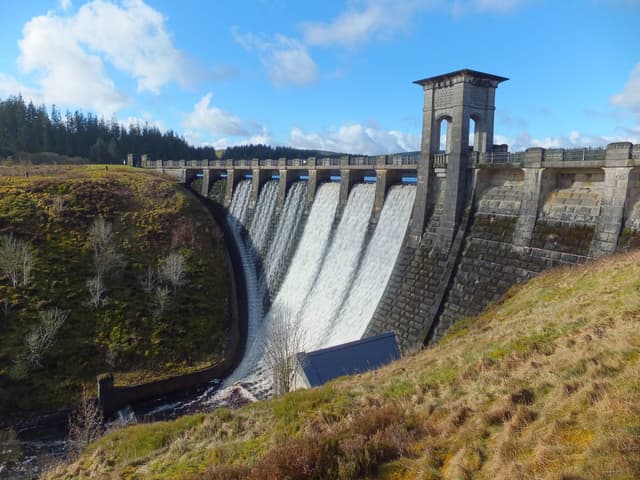 Alwen Reservoir dam during a spill event, water cascading over the overflow weir.
