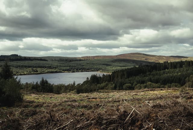 Wide landscape view of Alwen Reservoir, North Wales, the open water set among upland moorland and hills.