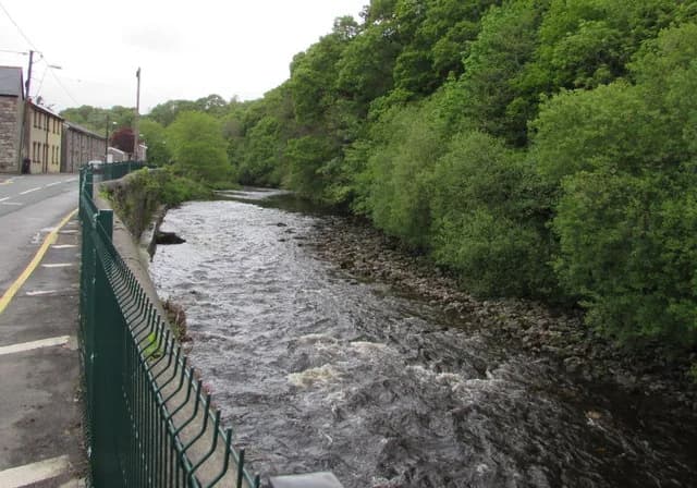 The River Tawe flowing through a wooded valley near Ystradgynlais, Wales