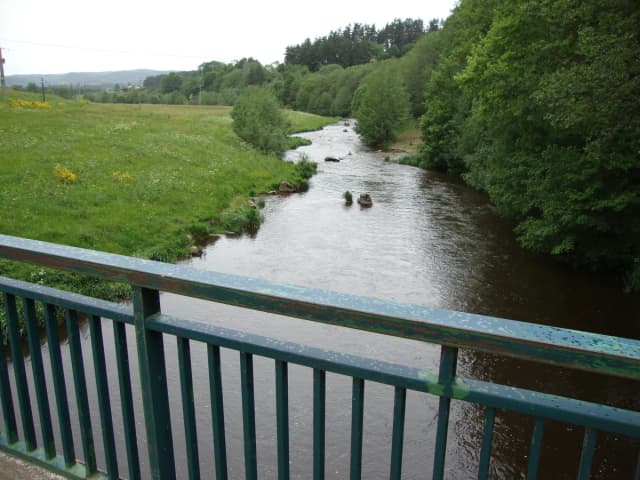 The Lignon du Velay river flowing through meadows near Tence, Haute-Loire, France