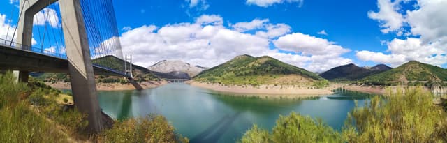 Panoramic view of Barrios de Luna reservoir, the full water body and Cantabrian mountain shoreline.