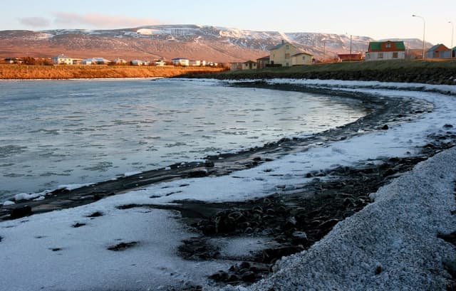 The Blanda river flowing through the town of Blönduós, north Iceland, in November.