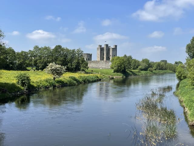 The River Boyne in the foreground with Trim Castle on the far bank, County Meath.