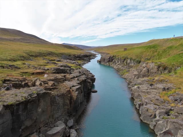 The turquoise glacial waters of Jökulsá á Brú flowing through a basalt column gorge in eastern Iceland