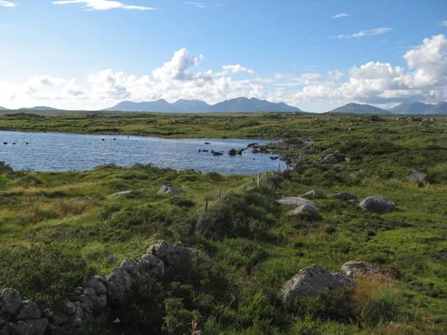 Invermore lough surrounded by Connemara bogland and low hills.
