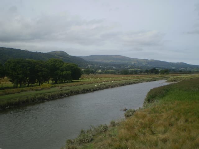 The River Conwy flowing through open countryside near Dolgarrog in the Conwy Valley.