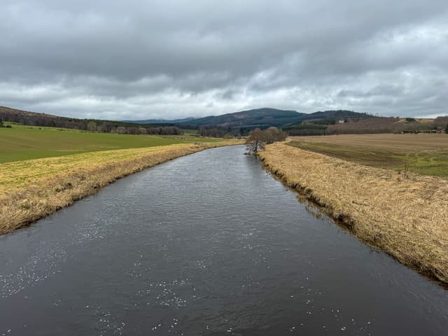 The River Don at Monymusk in winter light, a clear pool between wooded banks.