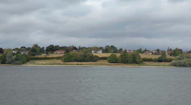 Draycote Water reservoir with Thurlaston village across the water on the far shore.