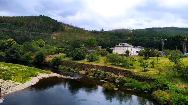 The Eo along the riverside walk at A Pontenova, Galicia, in summer.