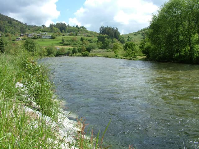 The Río Esva flowing past the village of Agüera in the Valle de Paredes, Asturias.