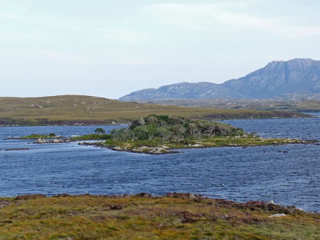 Loch Druidibeg, a machair loch on South Uist, with the hill of Hecla in the distance