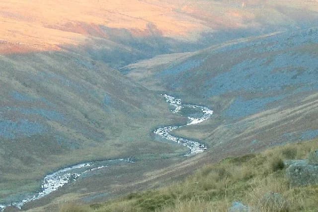 The Afon Twrch, a small upland river, winding through a moorland valley in the Brecon Beacons