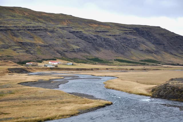 The Laxá í Kjós flowing past Möðruvellir farm in the Kjós valley with Möðruvallaháls behind.