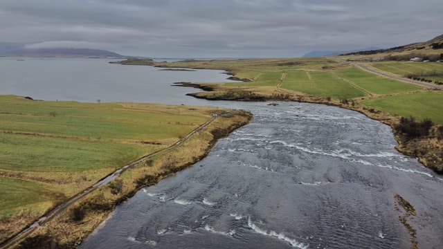 Aerial view of the mouth of the Laxá í Kjós entering Laxárvogur bay on Hvalfjörður, Iceland.