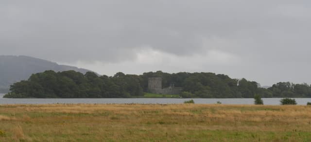 Panoramic view across the open water of Loch Leven toward Castle Island bearing Lochleven Castle, Kinross.