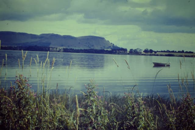 Open water of Loch Leven at Kinross on a clear day, with the Lomond Hills visible on the far shore.