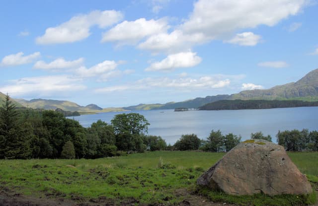 A broad shoreline view of Loch Maree near Talladale on the southern shore, the open loch extending into the distance.
