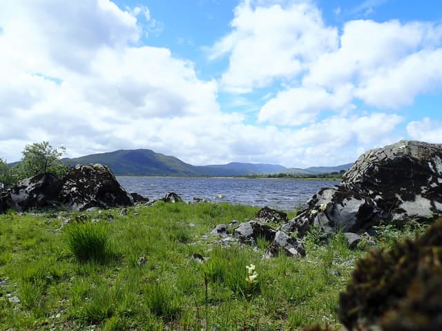 View south across the full expanse of Lough Mask from the western shore, distant southern hills.