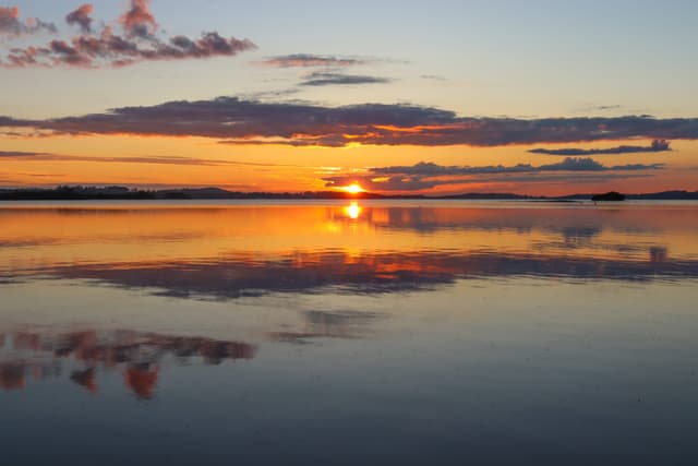Golden sunset over the open water of Lough Owel, County Westmeath.