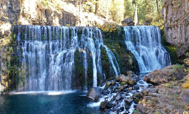 Middle Falls on the McCloud River cascading over volcanic rock into a deep pool, Shasta County, California.