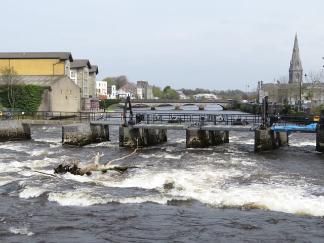 Salmon weir on the River Moy at Ballina, water flowing over the stone structure.