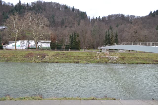 The Savinja river flowing through Celje, Slovenia, in winter low light.