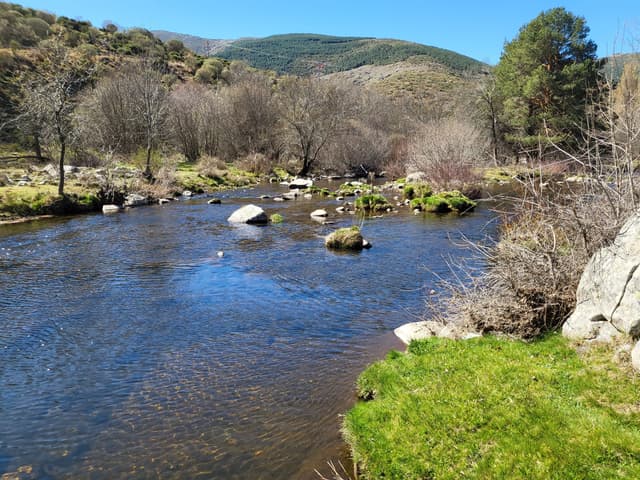 The Río Tormes flowing through Navacepeda de Tormes, Ávila, below the Gredos massif.