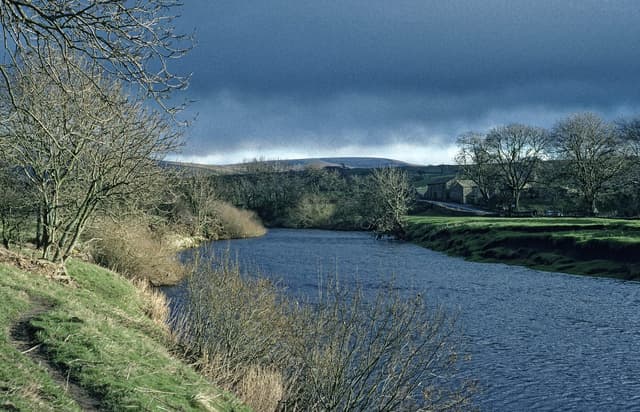 The River Ure winding through the valley floor near Throstle Nest between Askrigg and Thornton Rust.