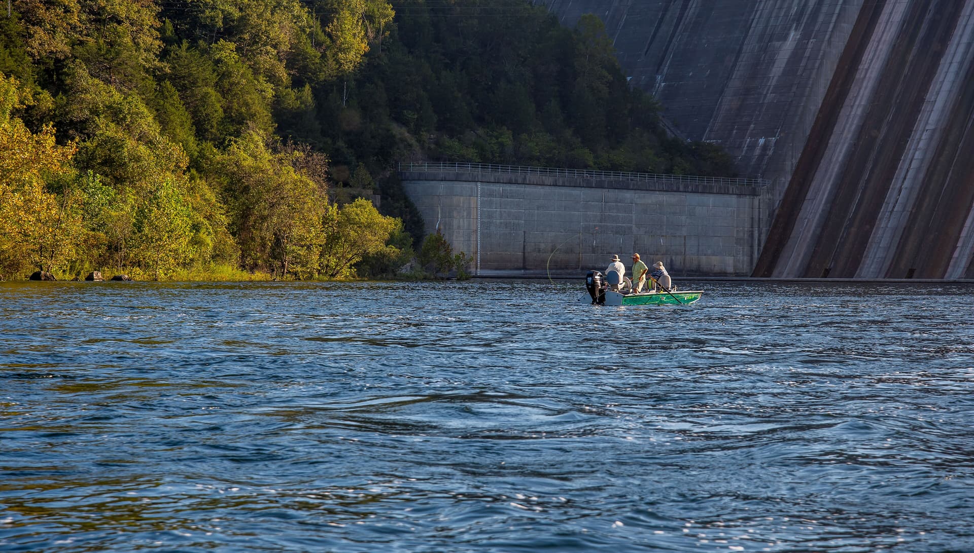 Group fishing in boat near Bull Shoals Dam on White River
