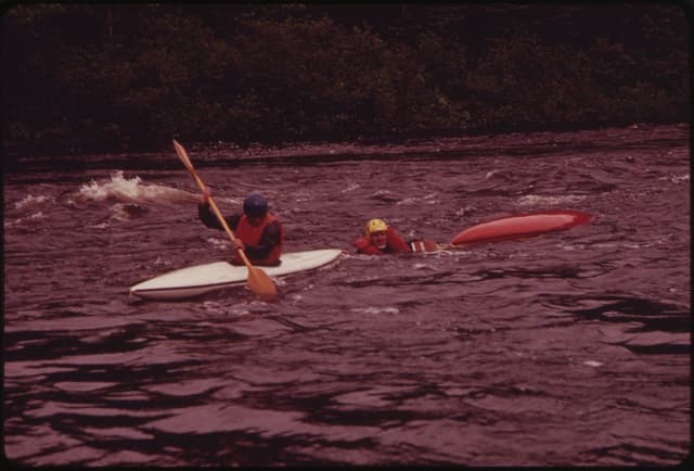 Kayaks on the upper reaches of the Androscoggin River, just below the bridge at Errol