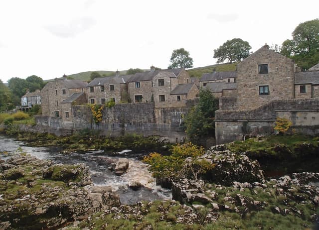 Linton Falls on the River Wharfe near Grassington, white water tumbling over limestone ledges.