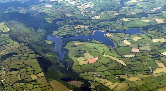 Aerial view looking down on Wimbleball Lake and Haddon Hill in Somerset, the full extent of the reservoir.